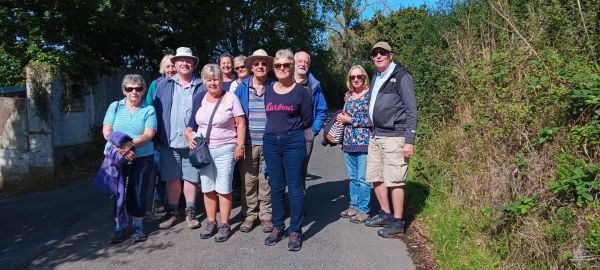 Photo of group of walkers outdoors on a path
